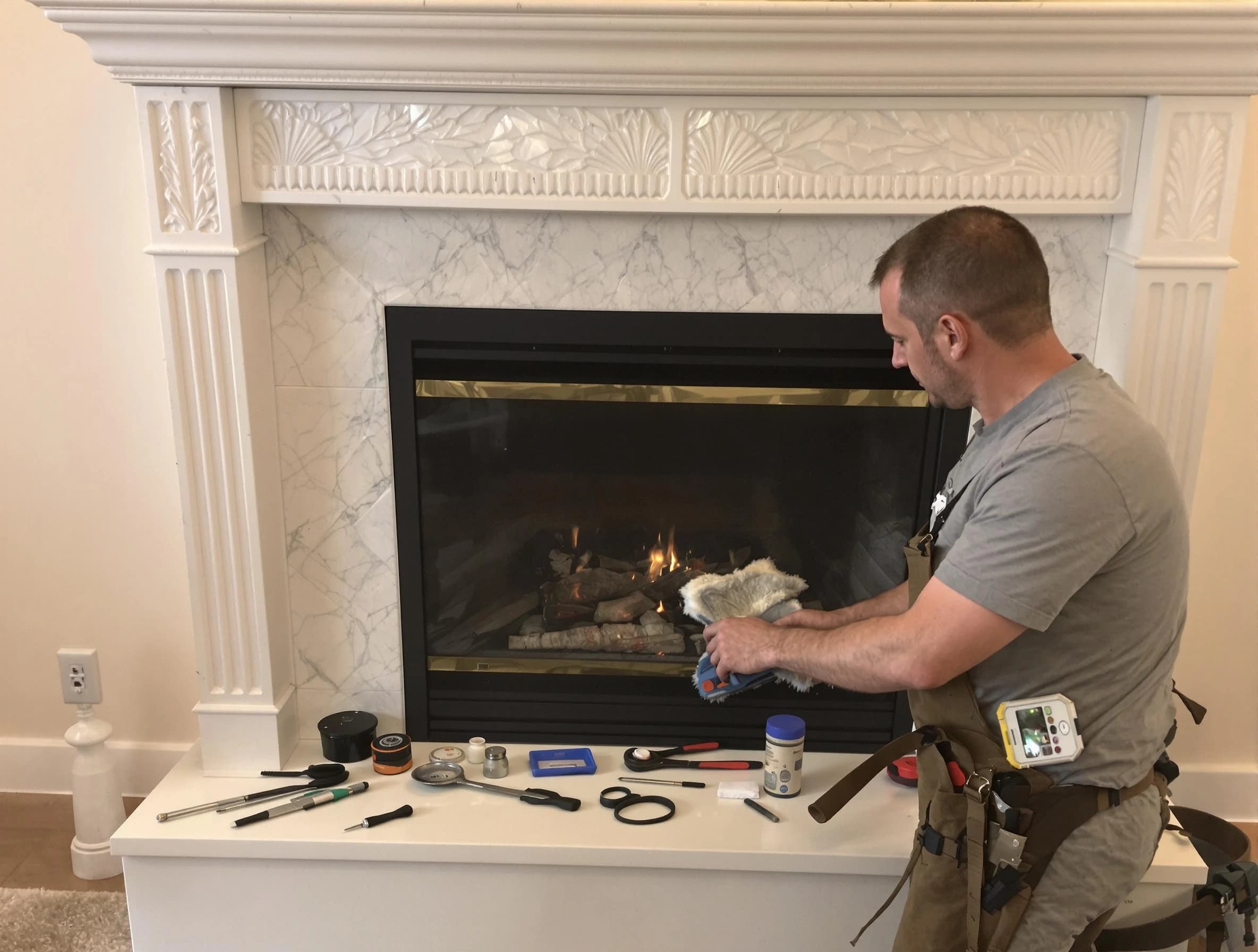 Baldwin Chimney Sweep performing fireplace maintenance in Baldwin, PA